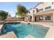 Backyard oasis featuring a sparkling pool with ample space for lounging and enjoying the outdoors at 3557 S Halsted Ct, Chandler, AZ 85286