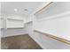 Spacious walk-in closet with ample shelving and wooden closet rods at 3557 S Halsted Ct, Chandler, AZ 85286