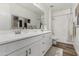 Bathroom featuring a double vanity with white cabinets and elegant decor, creating a clean and stylish space at 3749 E Sagebrush St, Gilbert, AZ 85296