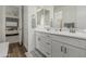 Bright bathroom features a double vanity with white cabinets and modern fixtures, complemented by hardwood floors and neutral decor at 3749 E Sagebrush St, Gilbert, AZ 85296