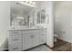 Bathroom featuring double sinks, a walk-in shower with glass enclosure, and a separate toilet at 3749 E Sagebrush St, Gilbert, AZ 85296