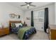 Bedroom with a double bed, ceiling fan, and window with natural light, providing a relaxing and cheerful space at 3749 E Sagebrush St, Gilbert, AZ 85296
