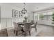 Elegant dining room with modern chandelier and large windows, perfect for entertaining at 3749 E Sagebrush St, Gilbert, AZ 85296