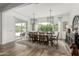 Bright dining room features an oversized table, chandelier and sliding glass doors at 3749 E Sagebrush St, Gilbert, AZ 85296