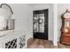 Charming entryway with stylish decor, a decorative mirror, and hardwood floors at 3749 E Sagebrush St, Gilbert, AZ 85296