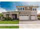 Elegant two-story home boasting a three car garage, flag and nicely landscaped lawn at 3749 E Sagebrush St, Gilbert, AZ 85296