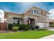 Attractive two-story home showcasing the manicured lawn and beautiful stone accents at 3749 E Sagebrush St, Gilbert, AZ 85296