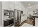 Updated kitchen with stainless steel appliances, modern cabinets and open to the living room at 3749 E Sagebrush St, Gilbert, AZ 85296