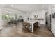 Spacious kitchen and dining area with large island, stainless steel appliances and breakfast bar at 3749 E Sagebrush St, Gilbert, AZ 85296