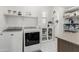 Well-organized laundry room with modern appliances, ample storage, and stylish hexagonal tile flooring at 3749 E Sagebrush St, Gilbert, AZ 85296