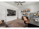 Cozy living room showcasing multiple monitors and a leather chair at 3749 E Sagebrush St, Gilbert, AZ 85296