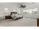 Serene main bedroom with neutral tones, large windows, and a ceiling fan, creating a relaxing retreat at 3749 E Sagebrush St, Gilbert, AZ 85296