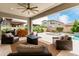 Outdoor patio features comfortable seating, a fire pit, a built-in grill, and a view of the backyard and pool at 3749 E Sagebrush St, Gilbert, AZ 85296