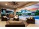 Outdoor patio with cozy seating, a fire pit, and a stunning sunset view, perfect for relaxation and entertainment at 3749 E Sagebrush St, Gilbert, AZ 85296