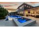 A backyard oasis with a pool, hot tub, and inviting patio area perfect for evening gatherings under the stars at 3749 E Sagebrush St, Gilbert, AZ 85296
