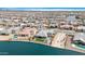 Panoramic view of a lakeside community featuring upscale homes with pools and water access at 40610 W Desert Fairways Dr, Maricopa, AZ 85138