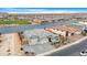 High angle aerial view of the home and lake in a residential neighborhood at 40610 W Desert Fairways Dr, Maricopa, AZ 85138