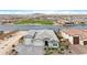 Aerial view of home with lake view, neighborhood park, and mature landscaping at 40610 W Desert Fairways Dr, Maricopa, AZ 85138