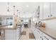 Open kitchen showcasing granite countertops, stainless steel appliances and white cabinetry at 40610 W Desert Fairways Dr, Maricopa, AZ 85138