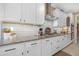 Bright kitchen with white cabinets, granite counters and stainless steel appliances at 40610 W Desert Fairways Dr, Maricopa, AZ 85138