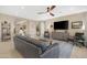 Spacious living room features modern decor and an open layout great for gatherings at 40610 W Desert Fairways Dr, Maricopa, AZ 85138