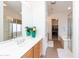Updated primary bathroom featuring a large vanity, walk-in shower and soaking tub with walk-in closet access at 4313 N 161St Ave, Goodyear, AZ 85395