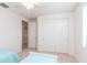 Bright bedroom featuring two twin beds, neutral carpeting, and a large closet at 4313 N 161St Ave, Goodyear, AZ 85395