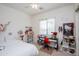 Bright bedroom with a desk area, Hello Kitty decor, and a large window offering natural light at 4313 N 161St Ave, Goodyear, AZ 85395