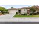 Well-maintained home with a two-car garage, neutral stucco, tile roof, and charming desert landscape at 4313 N 161St Ave, Goodyear, AZ 85395
