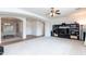 Bright open-concept living room with plush carpeting, neutral paint, and ample natural light at 4313 N 161St Ave, Goodyear, AZ 85395