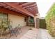 Charming patio area with brick flooring, pergola, and a cozy seating area at 4313 N 161St Ave, Goodyear, AZ 85395