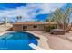 Inviting backyard featuring a sparkling pool, relaxing hot tub, and a well-maintained patio area at 4445 E Coconino St, Phoenix, AZ 85044