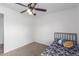 This bedroom has carpet, a ceiling fan, and a bed near the window at 4445 E Coconino St, Phoenix, AZ 85044