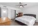 This main bedroom has carpet, a ceiling fan, and a mirrored closet at 4445 E Coconino St, Phoenix, AZ 85044