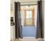 Enclosed balcony area with brown curtains at 461 W Holmes Ave # 374, Mesa, AZ 85210