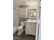 Cozy bathroom featuring a vanity with storage, a shower-tub combo, and modern fixtures at 461 W Holmes Ave # 374, Mesa, AZ 85210