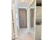 Hallway features storage cabinets and a full-size stacked washer and dryer at 461 W Holmes Ave # 374, Mesa, AZ 85210