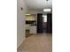 Inviting living room featuring neutral carpet, modern lighting, and seamless access to a well-appointed kitchen area at 461 W Holmes Ave # 374, Mesa, AZ 85210