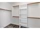 Walk-in closet featuring built-in shelving and clothes rods, perfect for organizing clothes and accessories at 5153 W Topeka Dr, Glendale, AZ 85308