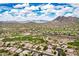 Amazing aerial view of desert community homes with golf course and mountain views at 6214 E Evening Glow Dr, Scottsdale, AZ 85266