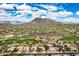 Gorgeous aerial view of desert community home with mountain backdrop and golf course views at 6214 E Evening Glow Dr, Scottsdale, AZ 85266