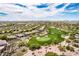 Beautiful aerial view of community home with golf course and mountain views at 6214 E Evening Glow Dr, Scottsdale, AZ 85266