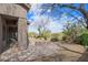 Serene backyard patio featuring a built-in fire pit, desert landscaping, and open sky views at 6214 E Evening Glow Dr, Scottsdale, AZ 85266