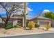 Attractive front exterior with desert landscaping, mature cacti, and a two-car garage at 6214 E Evening Glow Dr, Scottsdale, AZ 85266