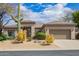 Charming home with desert landscaping, mature cacti, and a two-car garage at 6214 E Evening Glow Dr, Scottsdale, AZ 85266