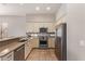 Bright kitchen featuring stainless steel appliances and stone countertops at 6214 E Evening Glow Dr, Scottsdale, AZ 85266