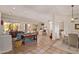 Naturally lit open concept living area with tile floors, comfortable couches and a view to dining and kitchen areas at 6214 E Evening Glow Dr, Scottsdale, AZ 85266