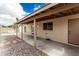 Large backyard with a covered patio, brick exterior, rock landscaping and outdoor seating at 6335 E Brown Rd # 1098, Mesa, AZ 85205