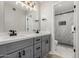 Bathroom features a double vanity with modern hardware and glass enclosed shower at 6335 E Brown Rd # 1098, Mesa, AZ 85205