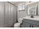 Bathroom showcasing a gray vanity, modern faucet and shower with gray tile at 6335 E Brown Rd # 1098, Mesa, AZ 85205